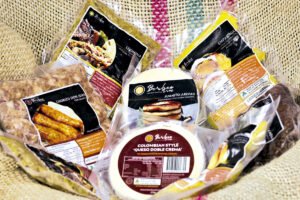 Empanadas de colores y lechona